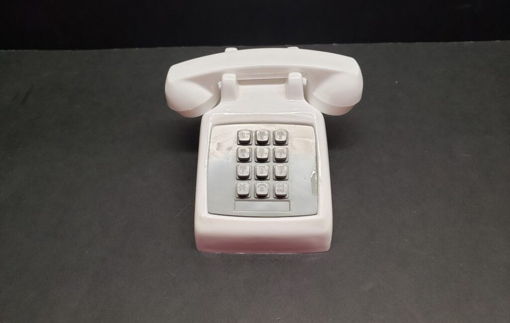 Tiny toy 2500 Telephone with flashing strobe lights.